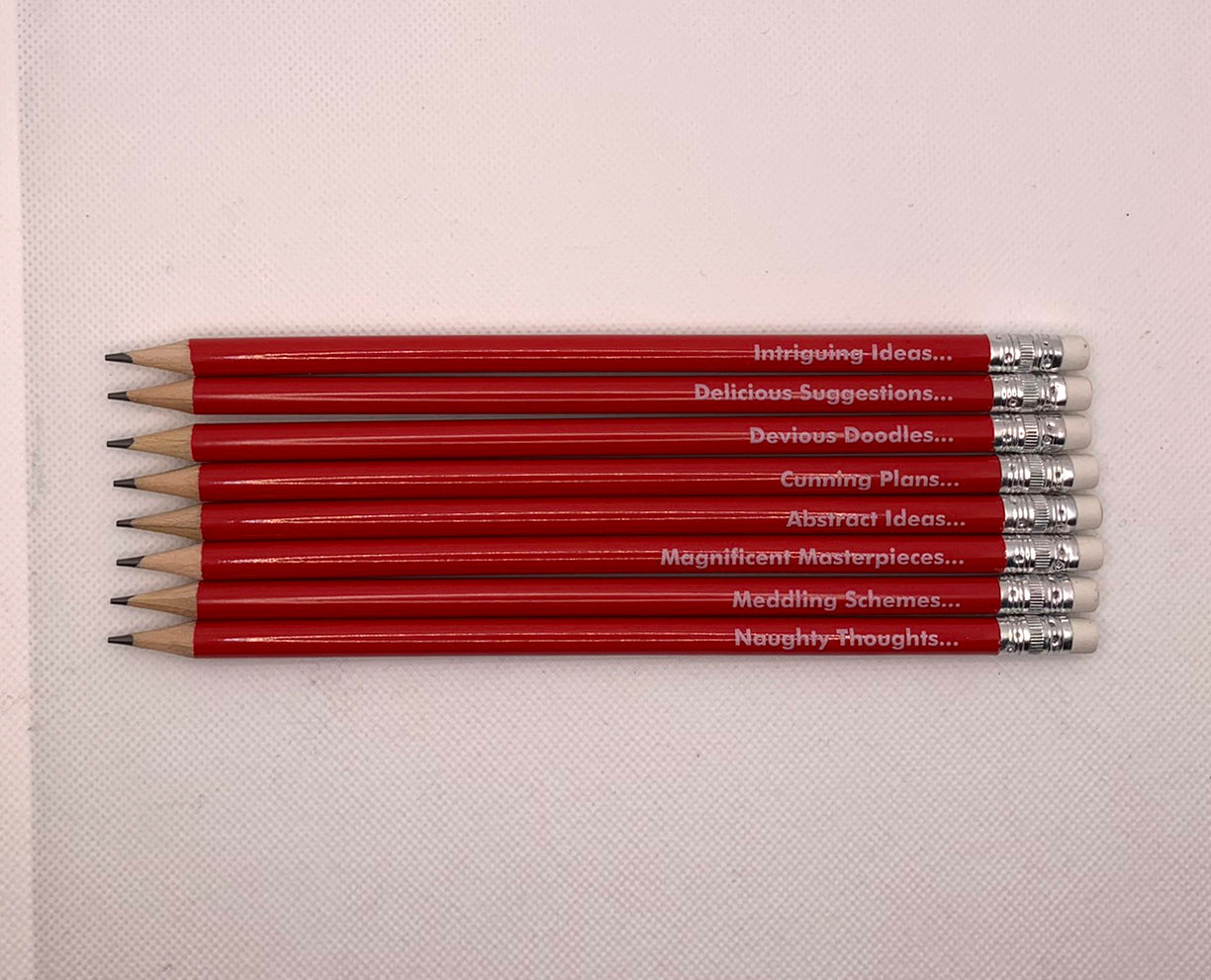 Number Ninety Five, Pencils for Plotting, 8 sharpened red pencils with white rubber tips, with phases such as, Magnificent Masterpieces, Abstract Ideas, Cunning Plans and Delicious Suggestions written on them in white text.