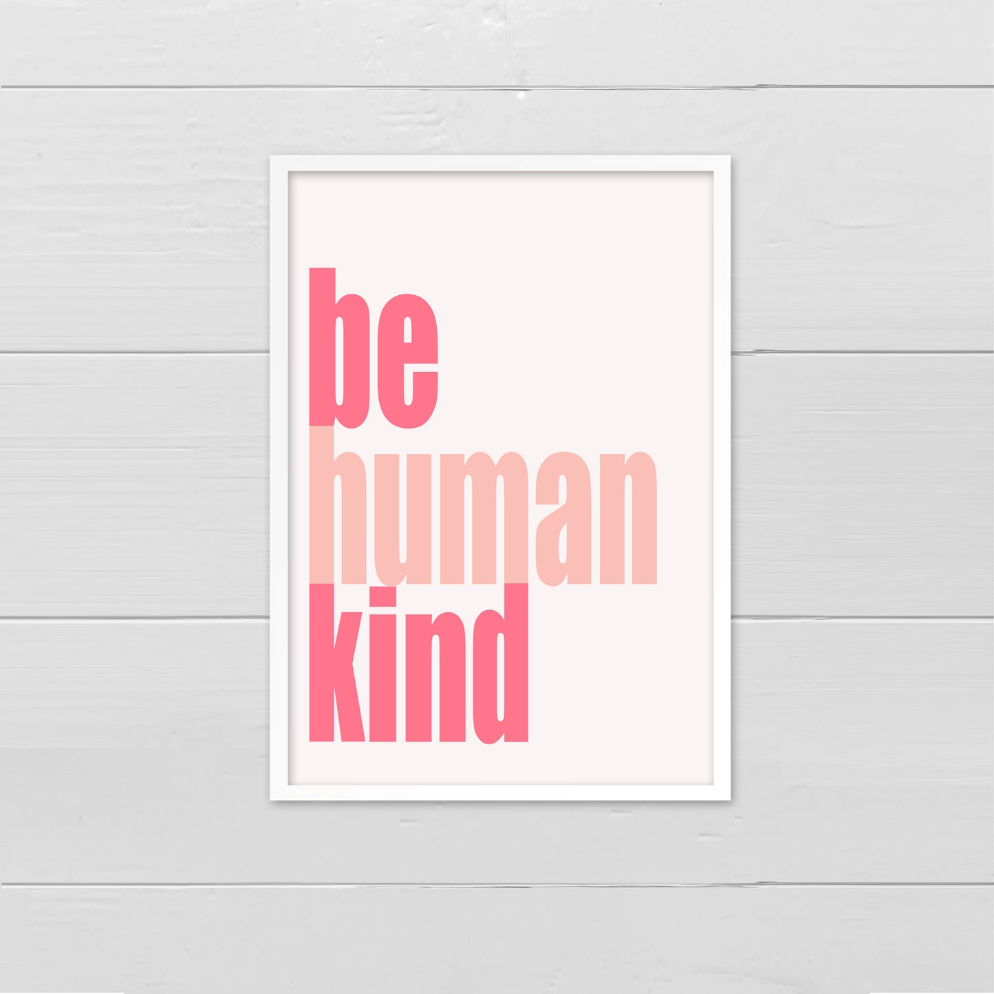 Portrait style print, with the words Be Human Kind, aligned to the left, written in pink onto a cream back ground.