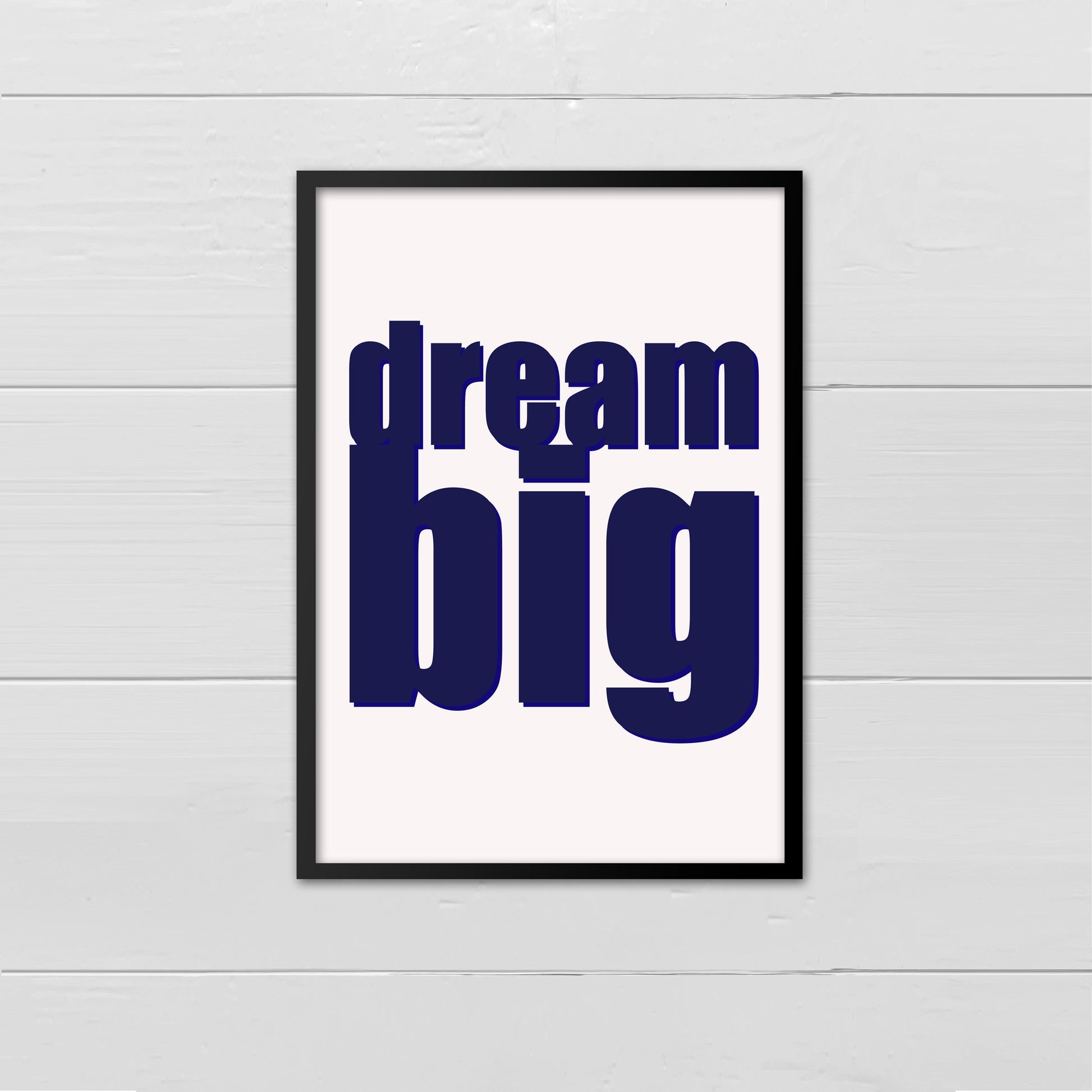 Portrait style print with the words Dream Big printed in large lowercase letters in navy onto a cream background